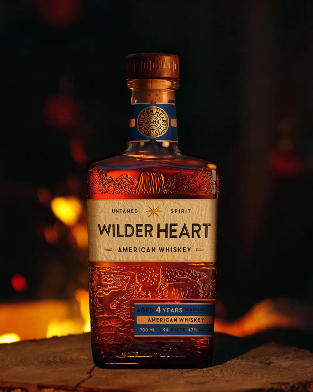 A bottle of Wilder Heart by the fire