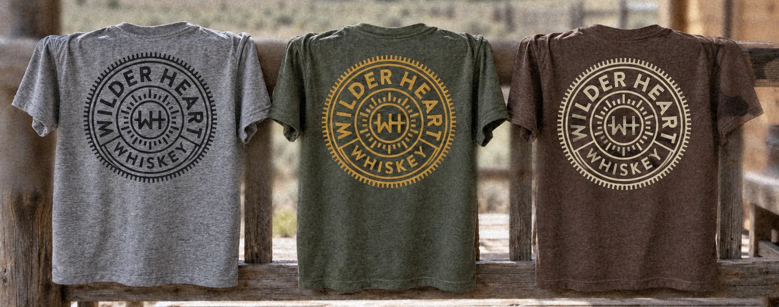The tee in Gray, Military Green and Espresso over a ranch porch rail