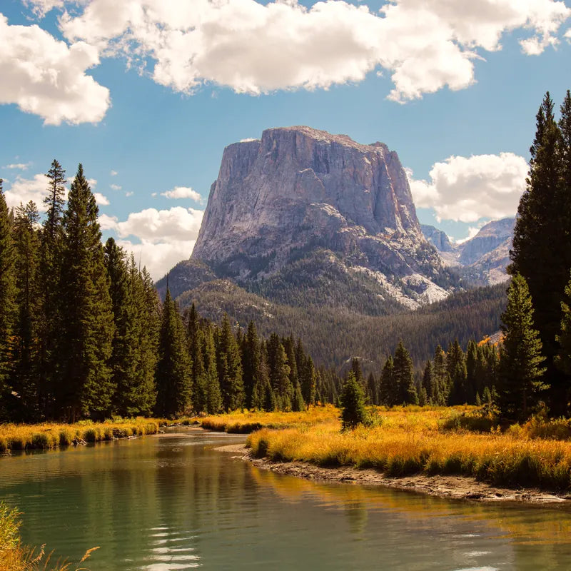 A river below a mountain at last light
